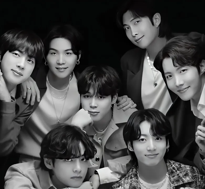 The seven members of BTS in a group photo.